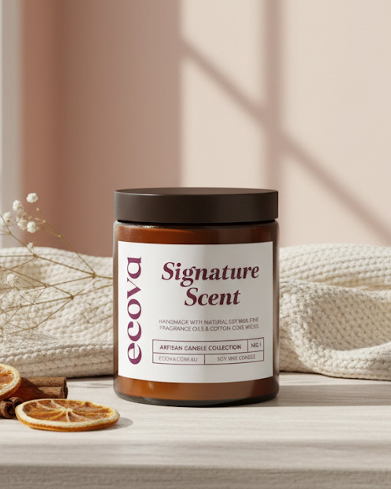 Ecoya candle with 'Signature Scent' label on a neutral background